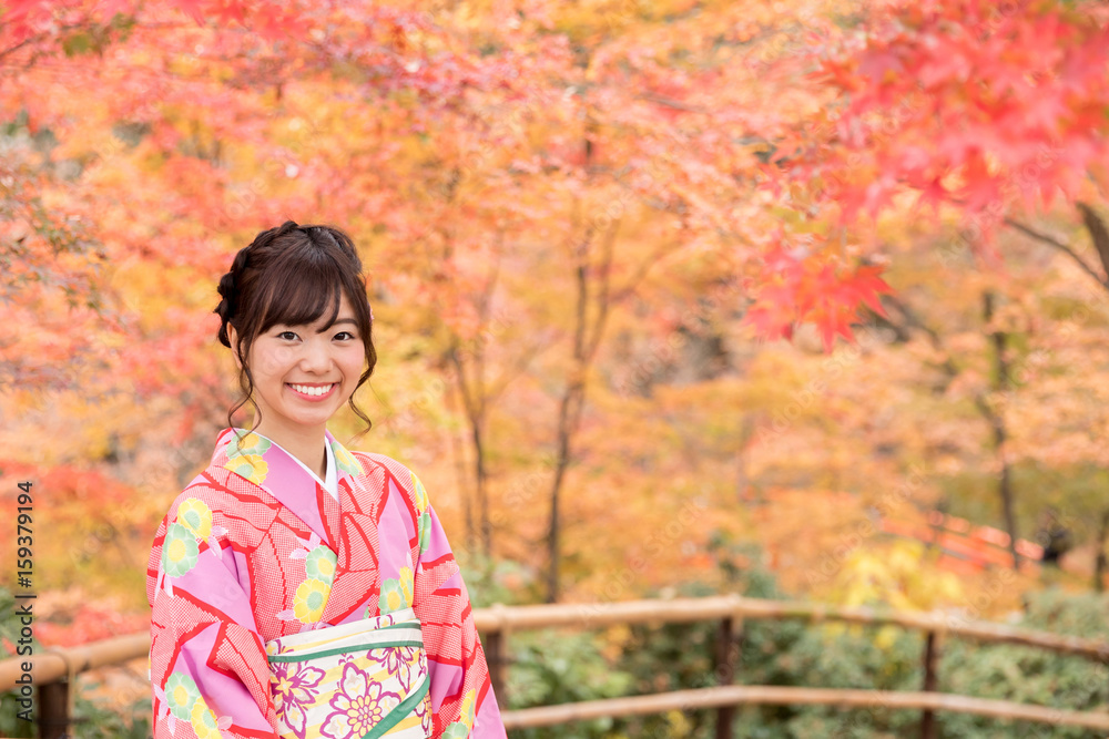 portrait of young asian woman waering kimono in autumn