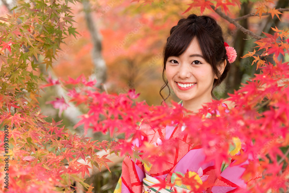 portrait of young asian woman waering kimono in autumn