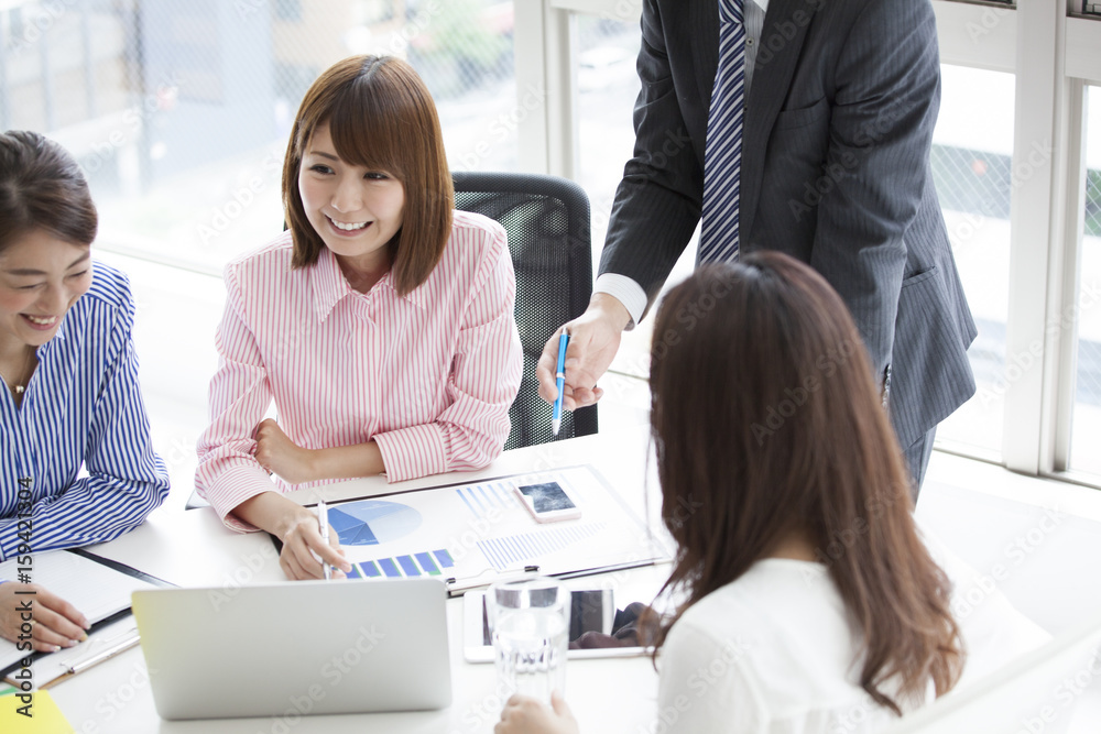 They are meeting at a bright office