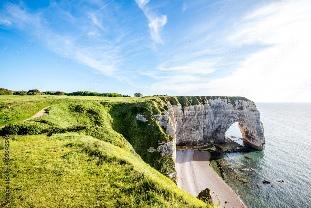 Landscape view on the famous rocky coastline near Etretat town in France during the sunny day