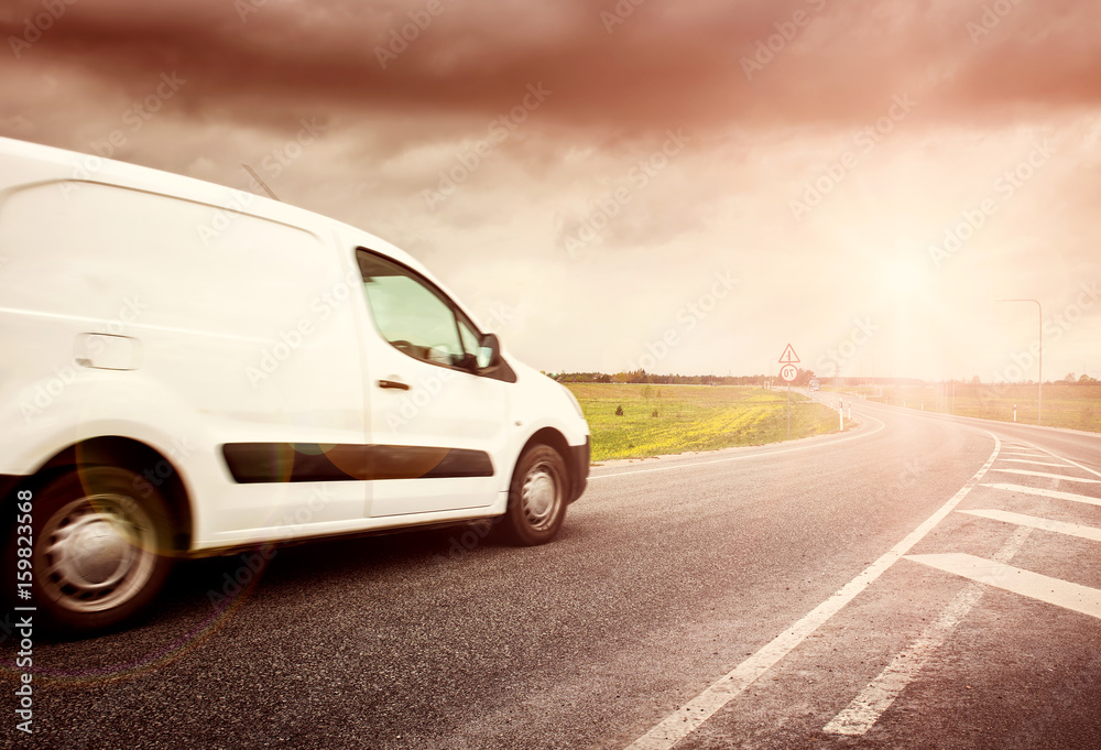 asphalt road on with a small truck. van moving