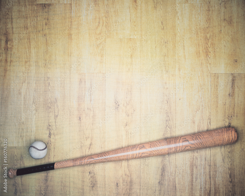 Baseball equipment on wooden backdrop