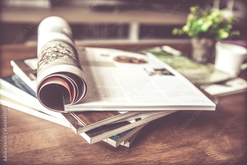 selective focus of  stacking magazine place on table in living room