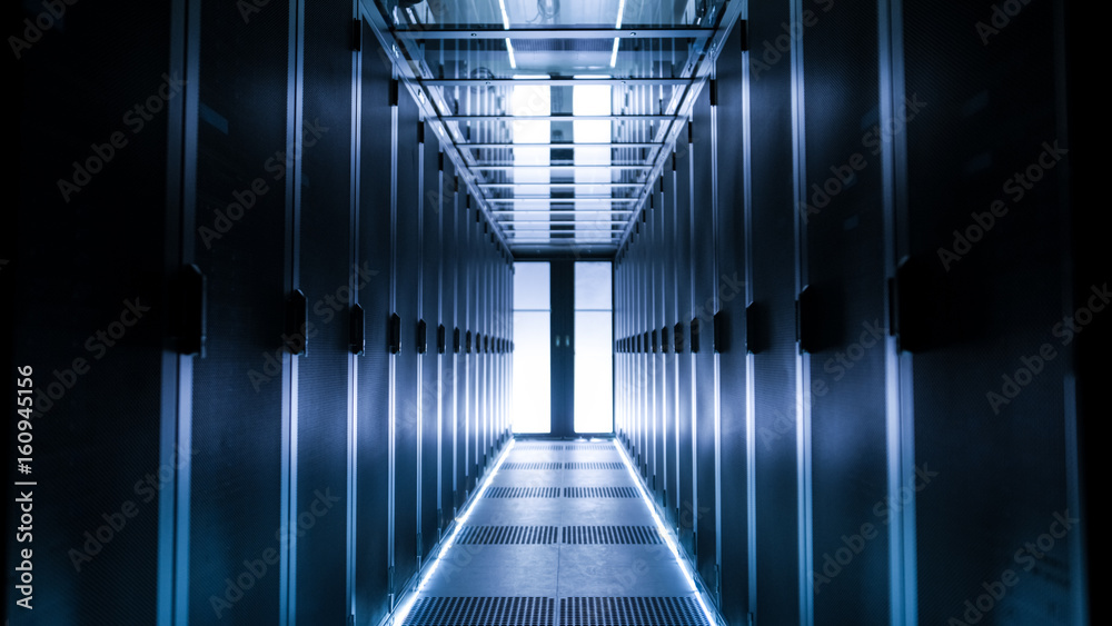 Shot of Corridor in Large Working Data Center Full of Rack Servers and Supercomputers.