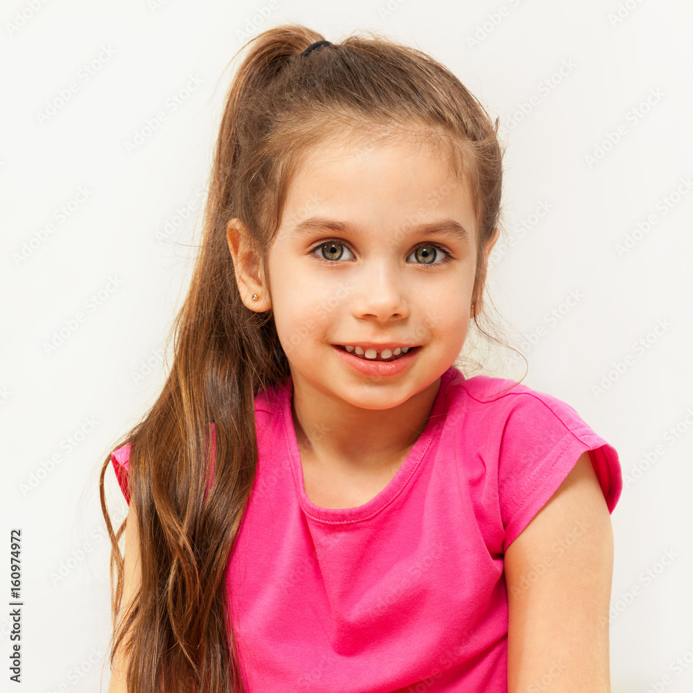 Portrait of smiling brunette seven years old girl