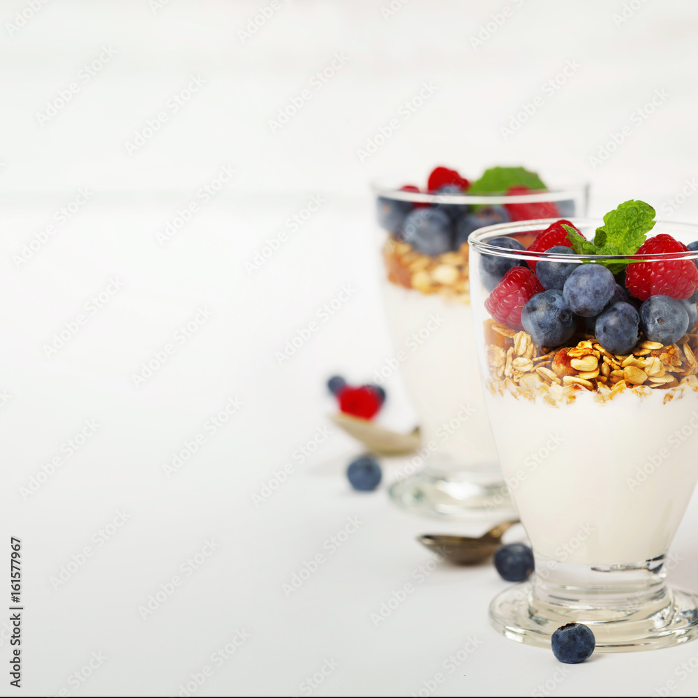 Freshly prepared yogurt parfait with fresh fruit and mint