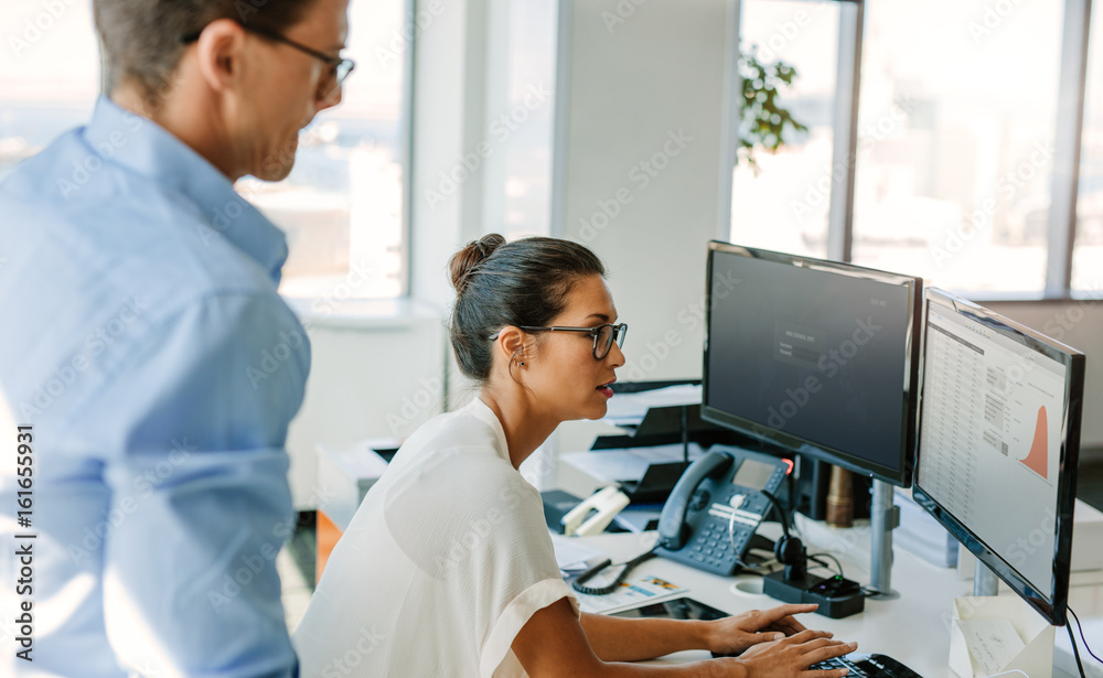 Business team working together on computer