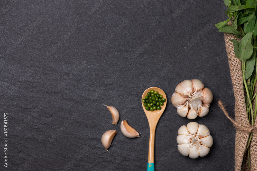 Fresh garlic. Garlic Bulb on black stone table.