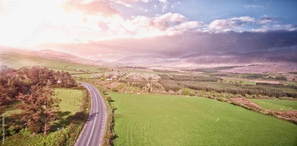 High angle view of road amidst grassy landscape