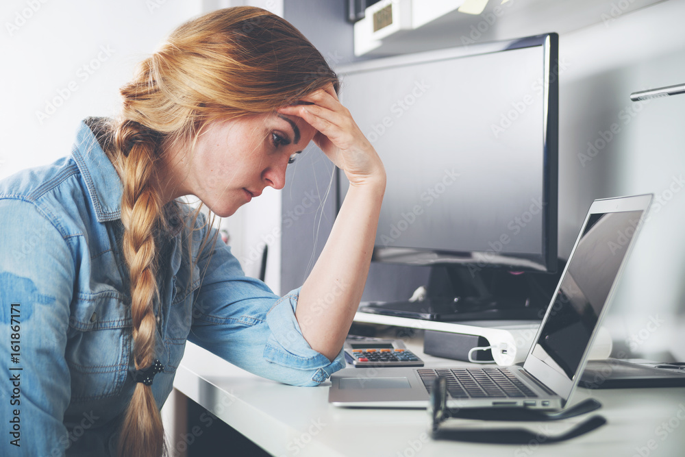 Stressed tired woman working at home office concept of problems