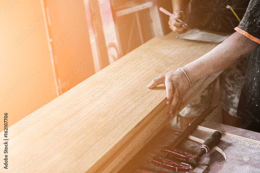 construction concept with old wood tools with wood workshop and light flare effect with color tome i