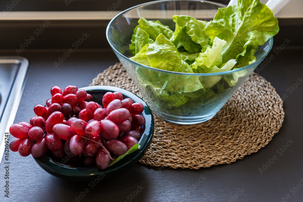 healthy breakfast concept with green cabbage and grape with fruit in daylight morning time