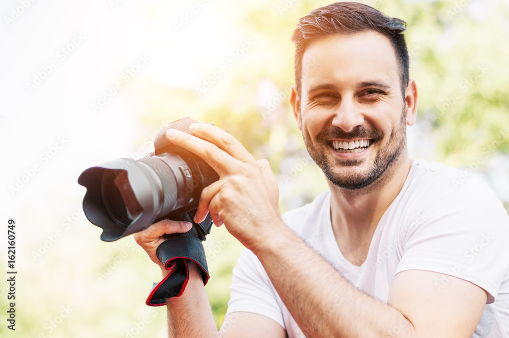 Portrait of a professional photographer with a camera