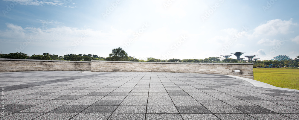 empty floor near park in blue sky