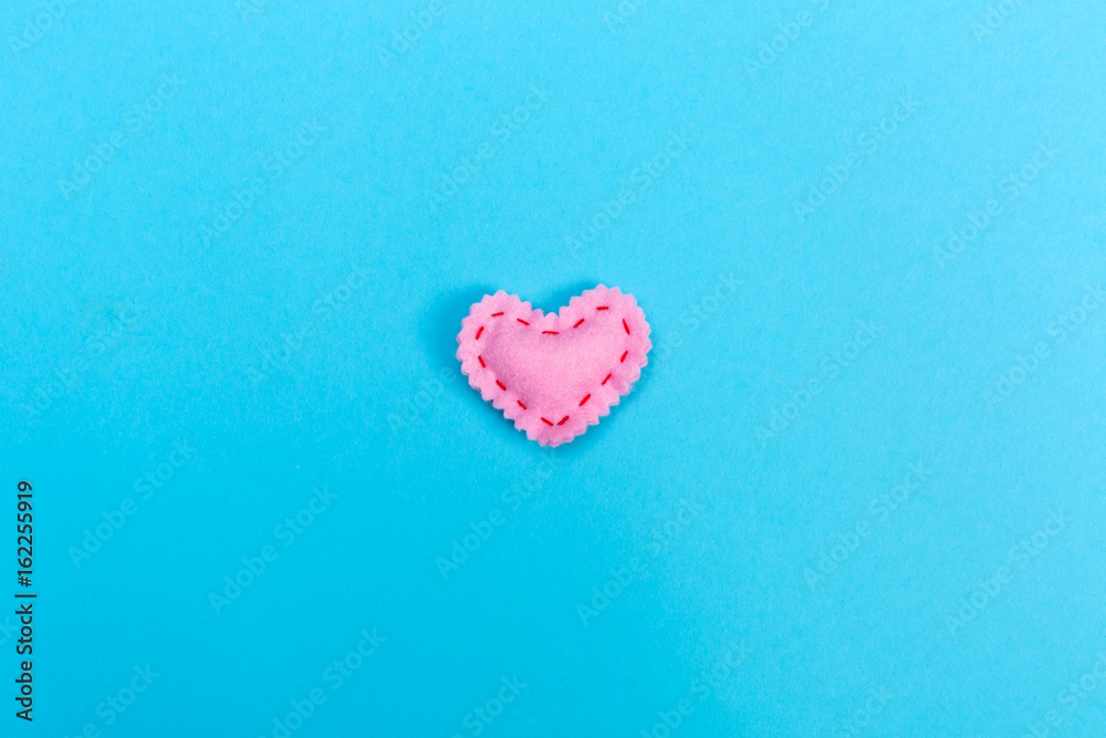 Handmade heart cushions on a blue background