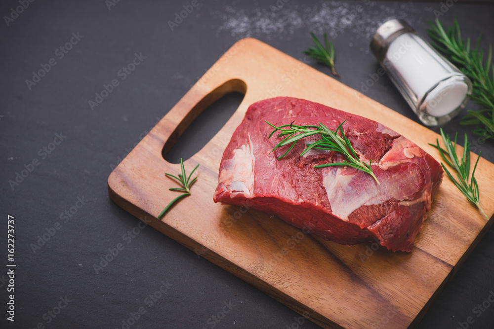 Raw beef meat on a cutting board