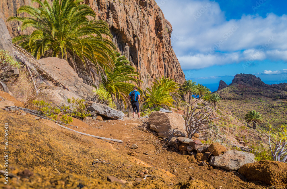 Hiker on a trail in the Canary Islands, Spain