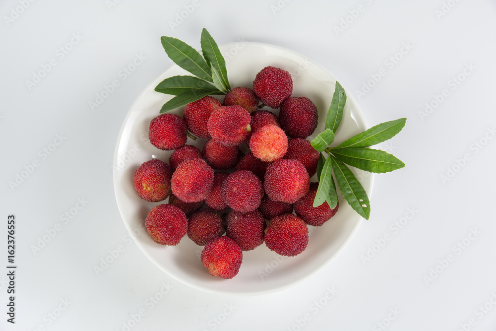 arbutus in the plate isolated on white background
