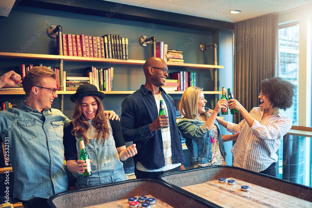 Group of friends having fun at bar