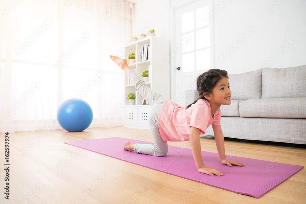 little dancer using doing yoga exercise