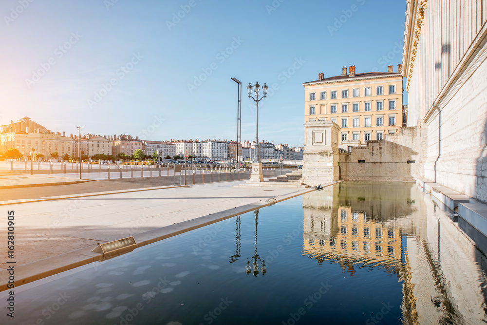 Morning street view with neo-classical palace and beautiful riverside in the old town of Lyon