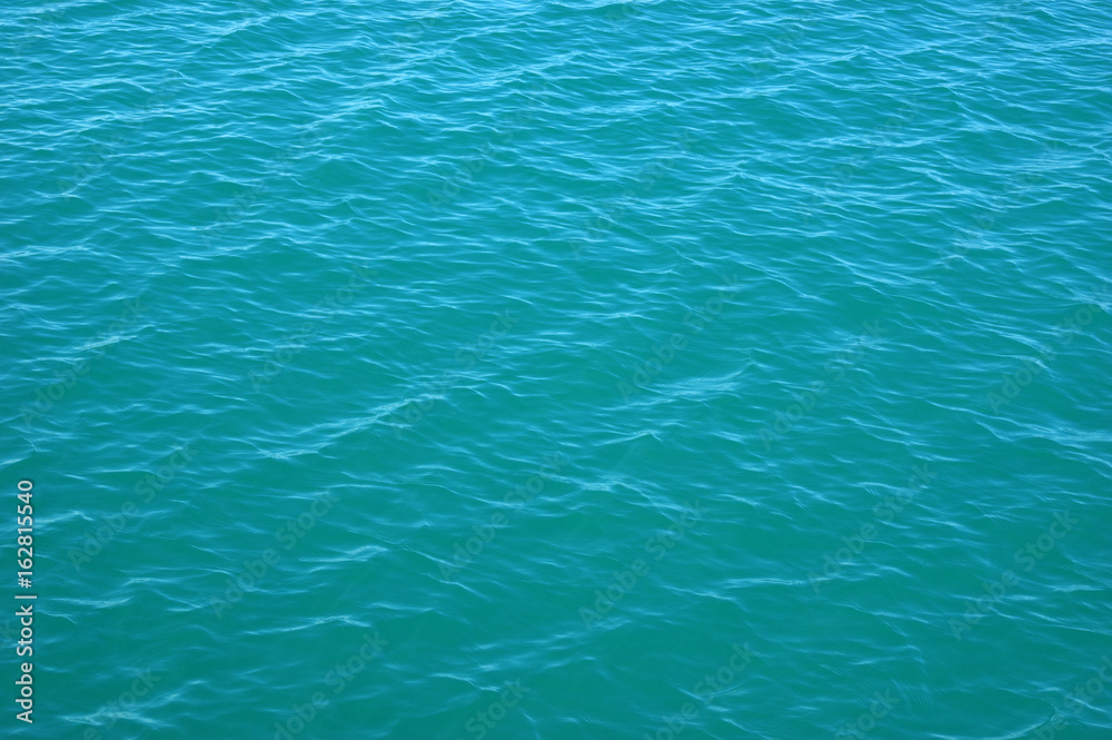 Blue sea surface with waves