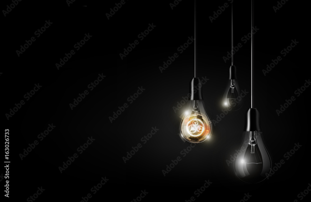 Glowing abstract futuristic light bulb is hanging between a lot of turned off light bulbs on dark bl