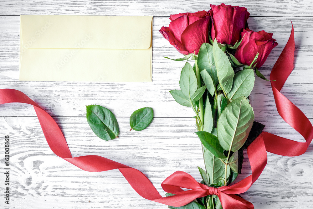 concept Valentines Day with flower wooden background top view