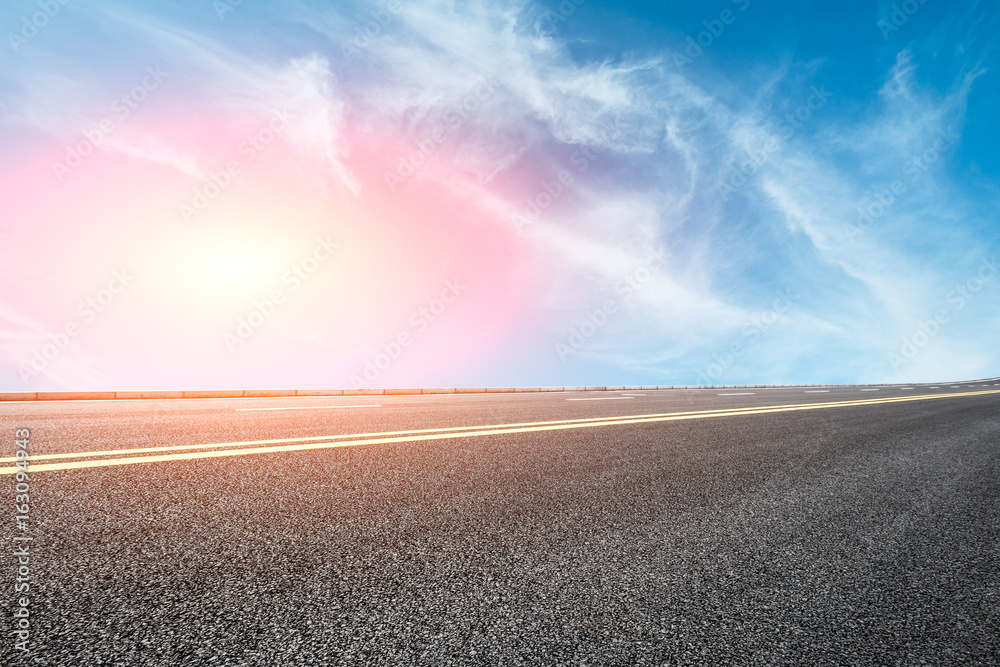 Asphalt road and sky cloud landscape at sunset