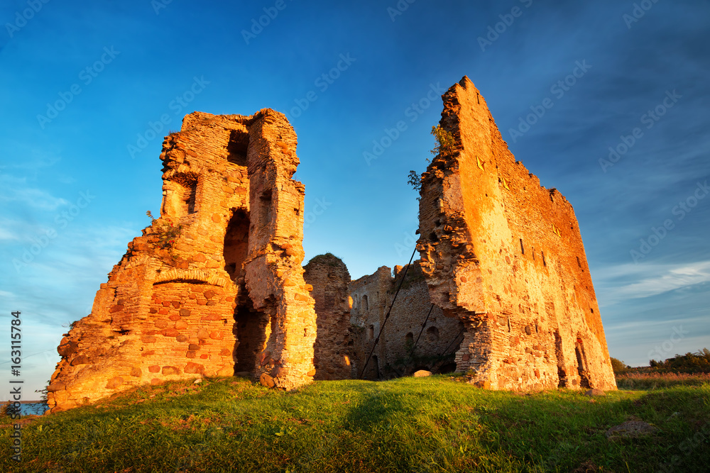 Old castle ruins in sunset light. Toolse in northern Estonia