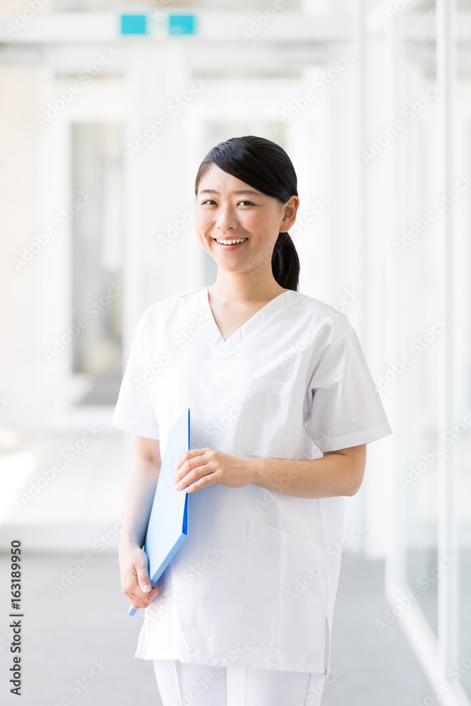 portrait of young asian nurse in hospital