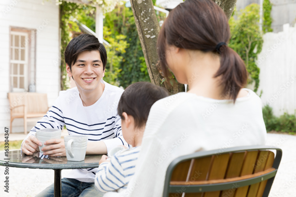 young asian family relaxing in cafe