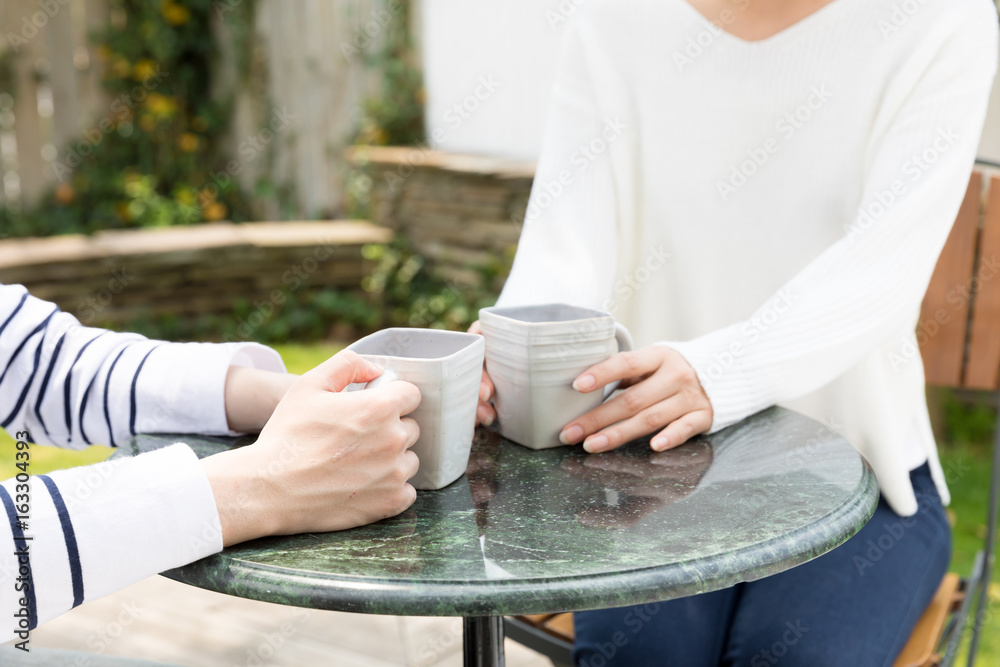 young asian couple relaxing in cafe