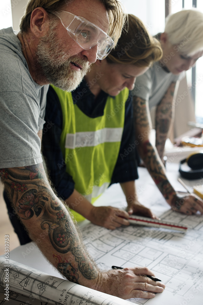 Construction team working on a blueprint