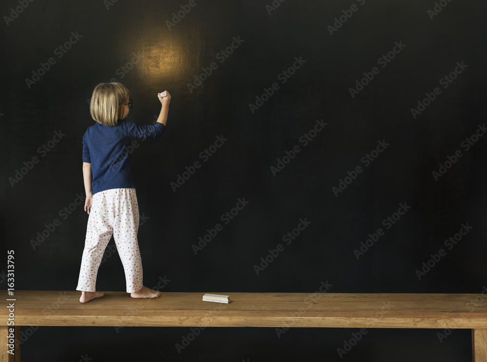 Little Girl Writing Blackboard Concept