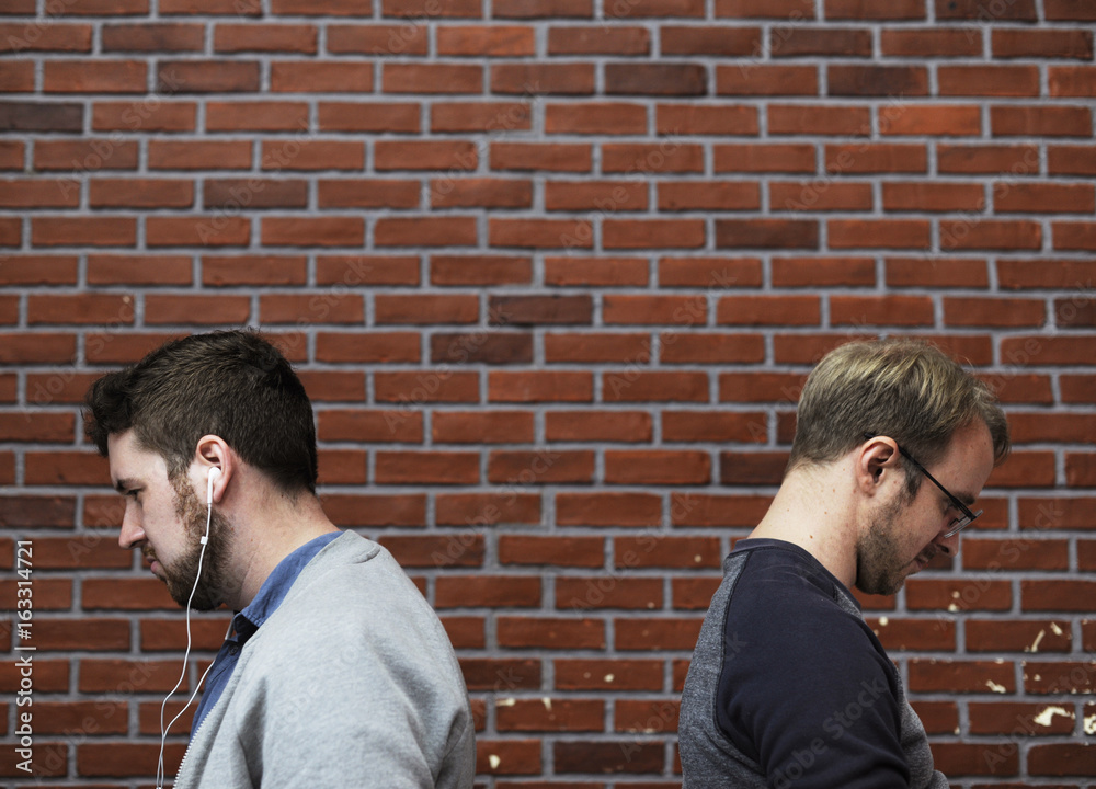 Men Relaxing on Break Time with Brick Walls Background