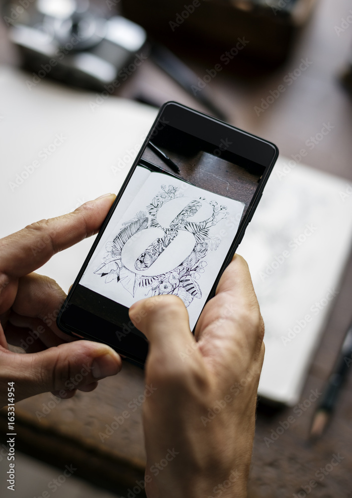 Closeup of mobile phone screen showing snap drawing art