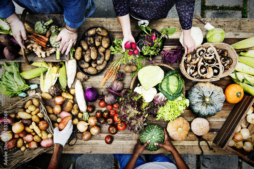 Aerial view of fresh organic various vegetable on wooden table