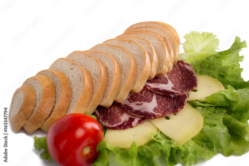 Composition of bread, meat, vegetables and cheese