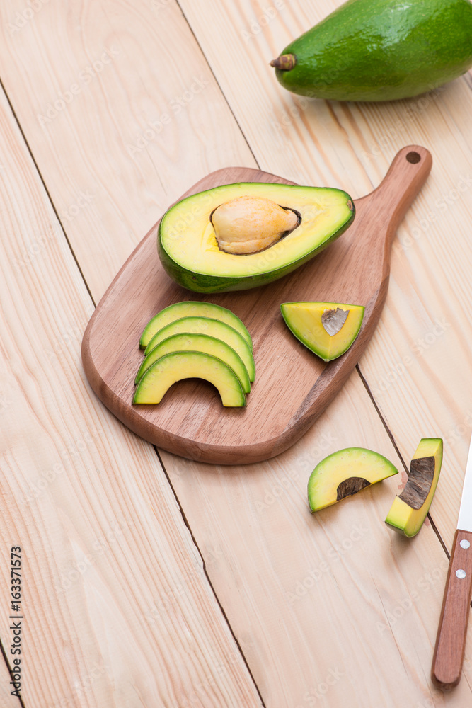 Healthy food concept. Fresh organic avocado on table