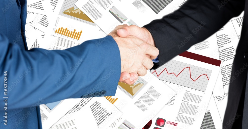 Business handshake against document backdrop