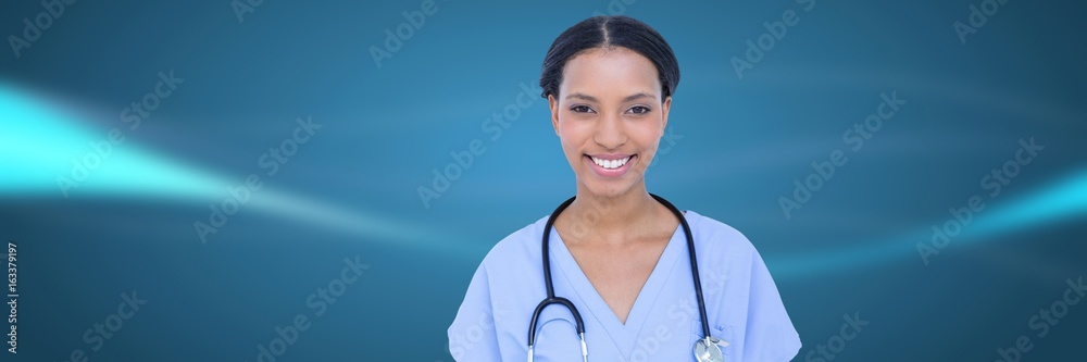 Doctor against blue blurred abstract background