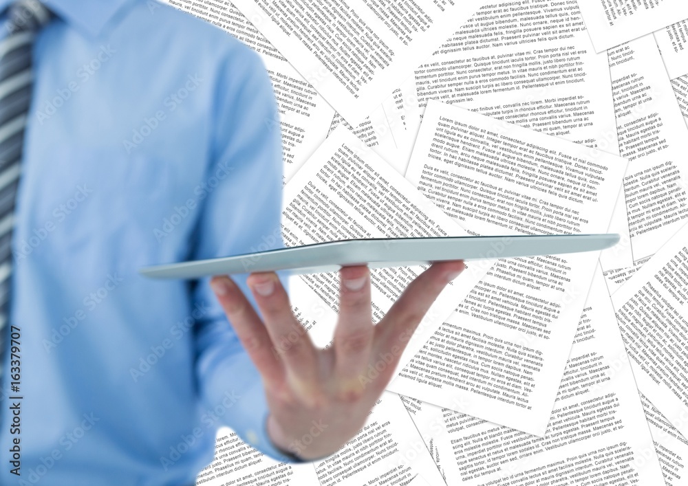 Business man mid section with tablet against document backdrop