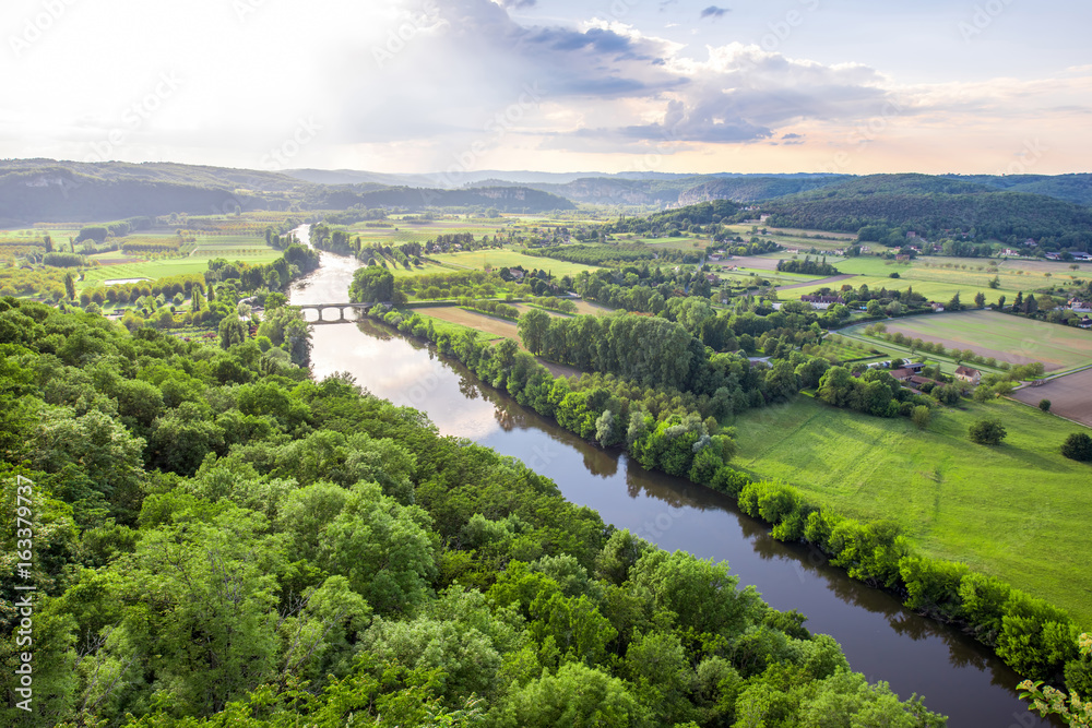 Aerial landscape view on Dordogne river with the old bridge and beautiful fields near Domme village 