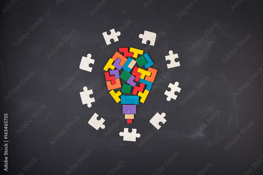 Business creative solution concept jigsaw on the blackboard