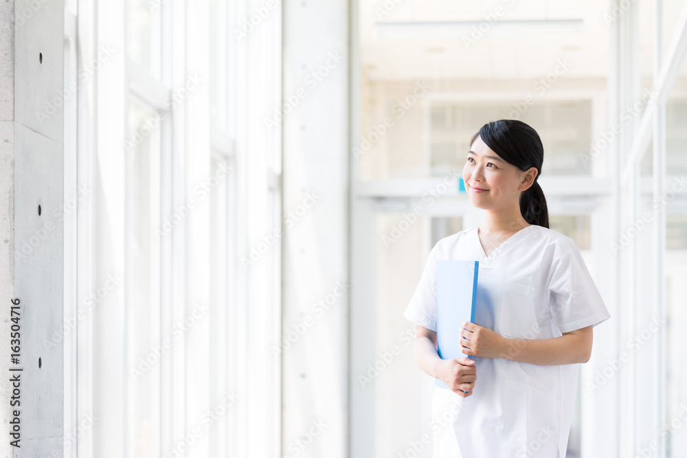 portrait of young asian nurse in hospital