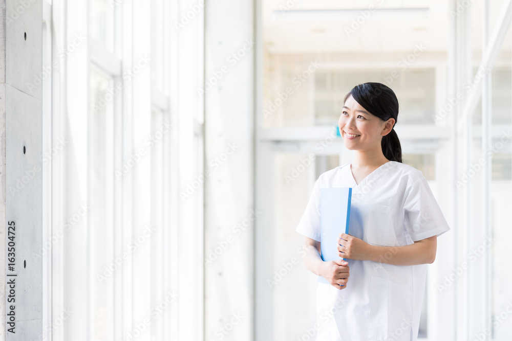 portrait of young asian nurse in hospital