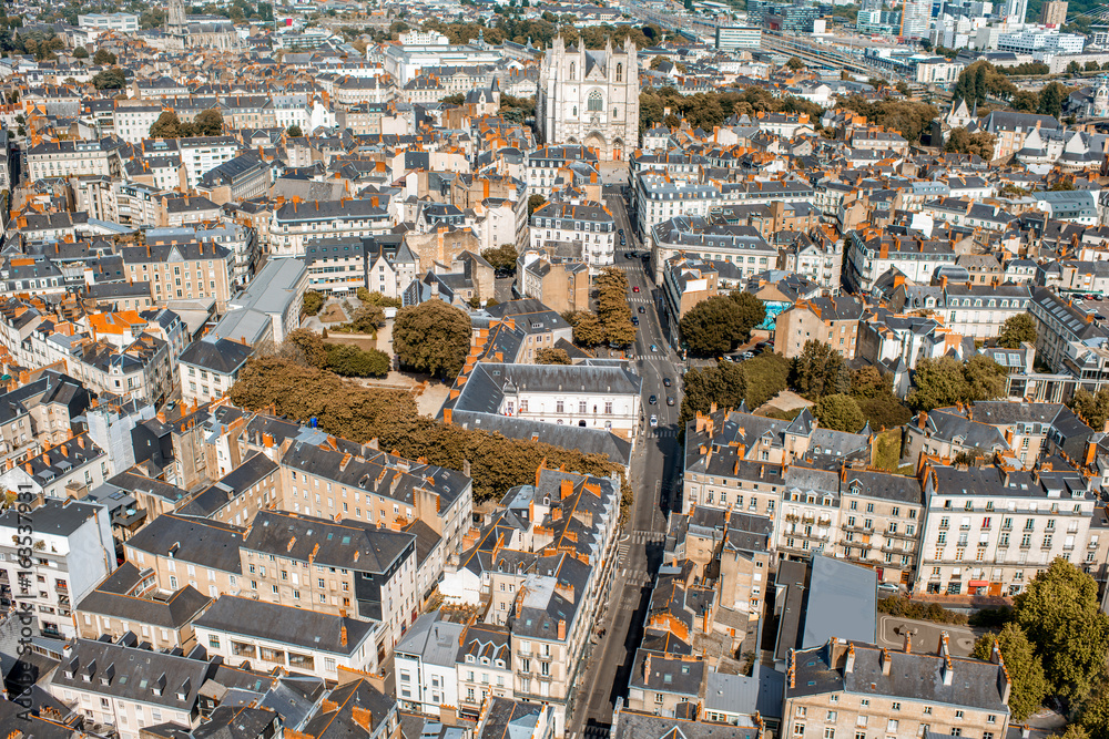 Aerial cityscape view with beautiful buildings and cathedrals in Nantes city during the sunny weathe