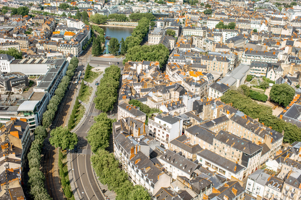 Aerial cityscape view with beautiful buildings and wide avenue in Nantes city during the sunny weath