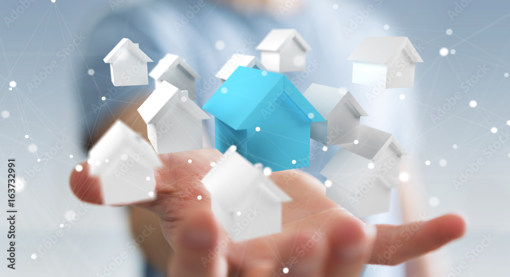 Businessman using 3D rendered small white and blue houses